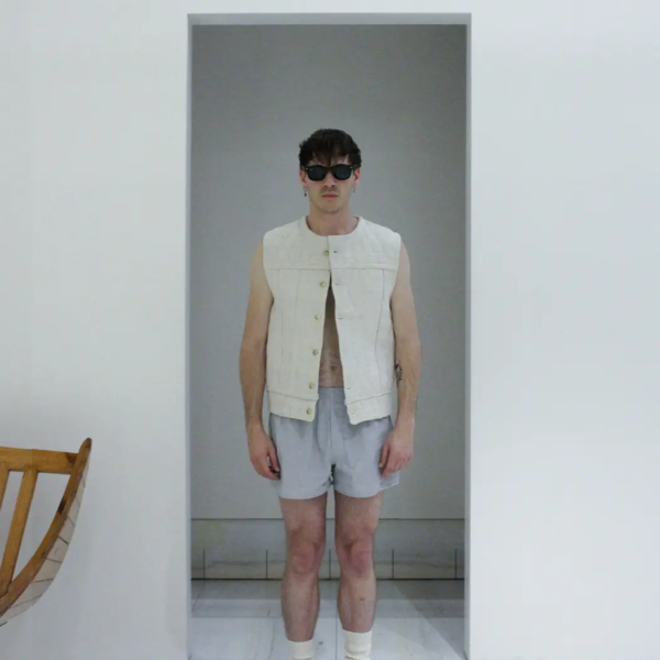 Male Model wears Hemp Canvas Vest, Matelassé pattern. Strong and raw with hexagonal cufflinks buttons