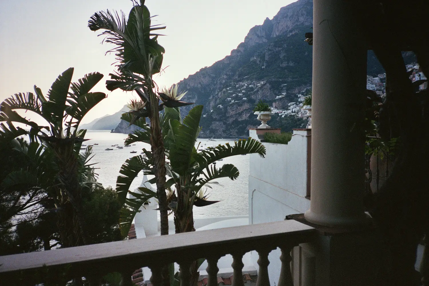 Reversible deck chairs and umbrellas rest on a cantilevered rock platform, a minimal intervention that preserves shoreline geology_2 Villa Treville