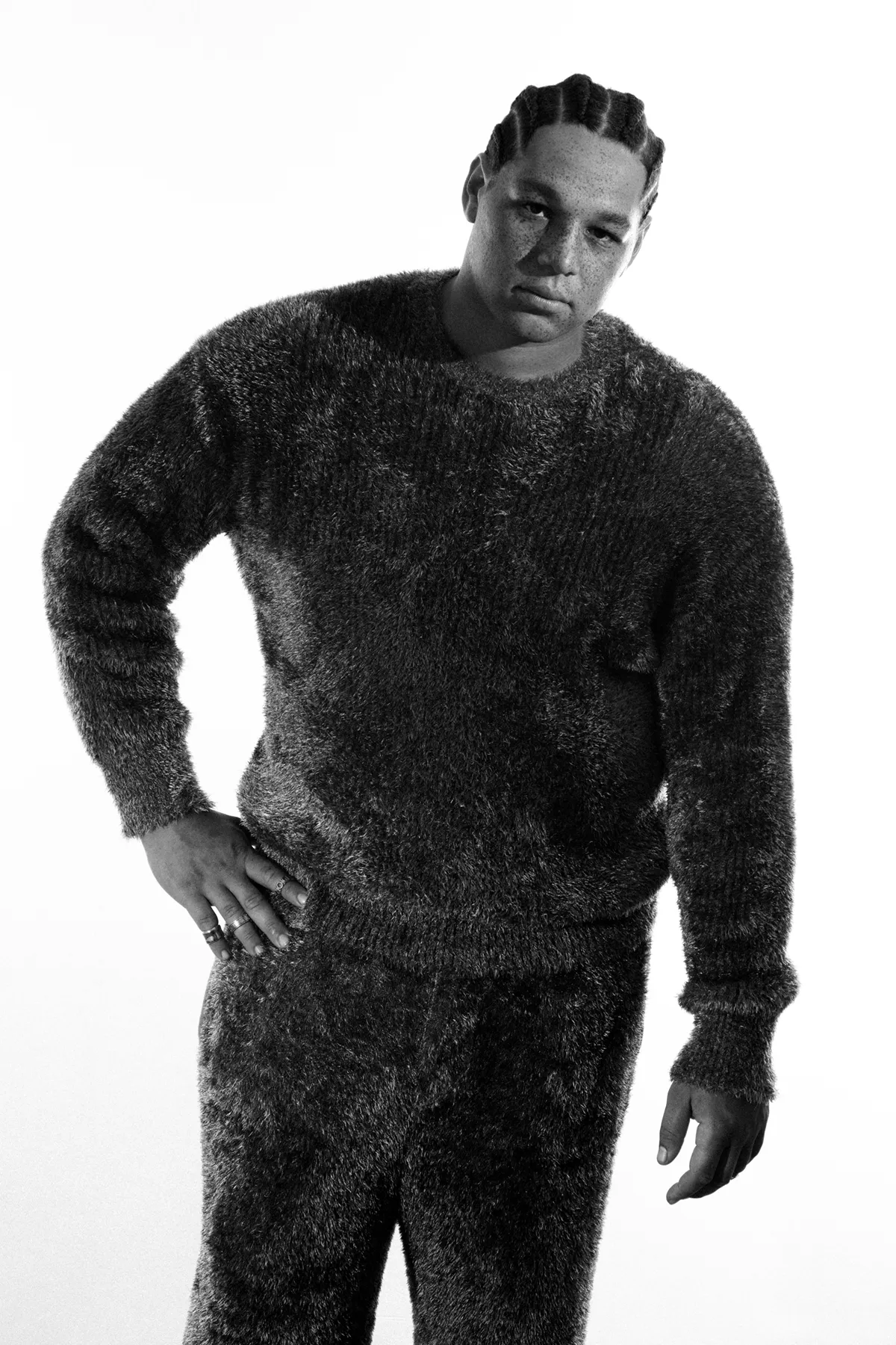 Sweater and pants LGN Louis Gabriel Nouchi, rings left to right System, Dior, Hermès