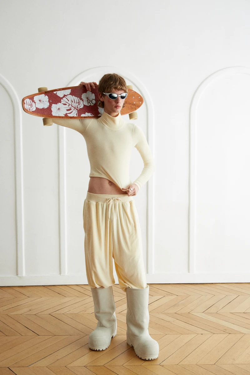 Sweater, pant and boots Balenciaga, sunglasses Oakley, skate Roxy. Photography Jeanne Lucas, styling Alexandra Conti