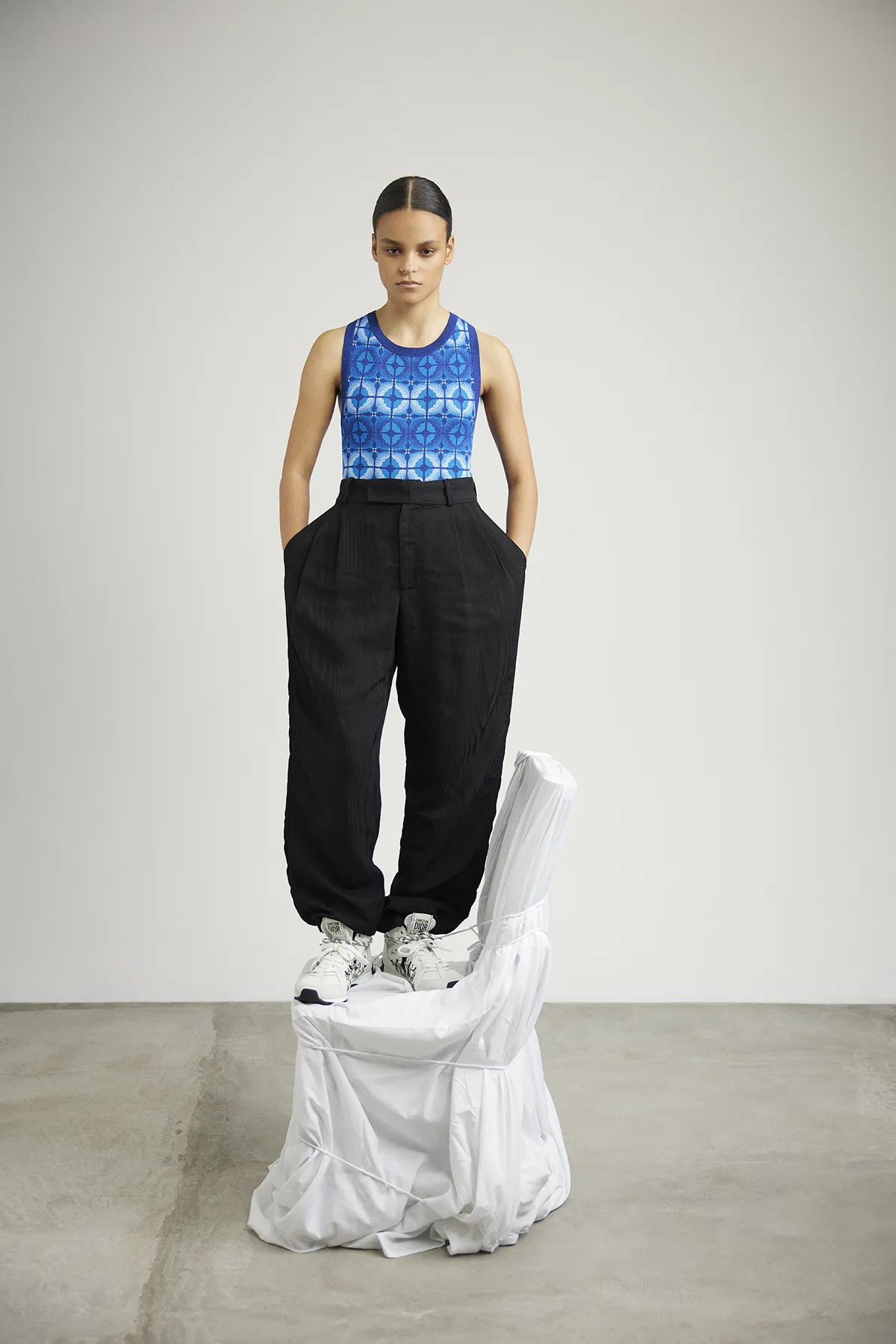 Tank top and trousers Ahluwalia, shoes Dior - Photography Amber Grace Dixon, styling Oisin Boyd and Ellie May Brown