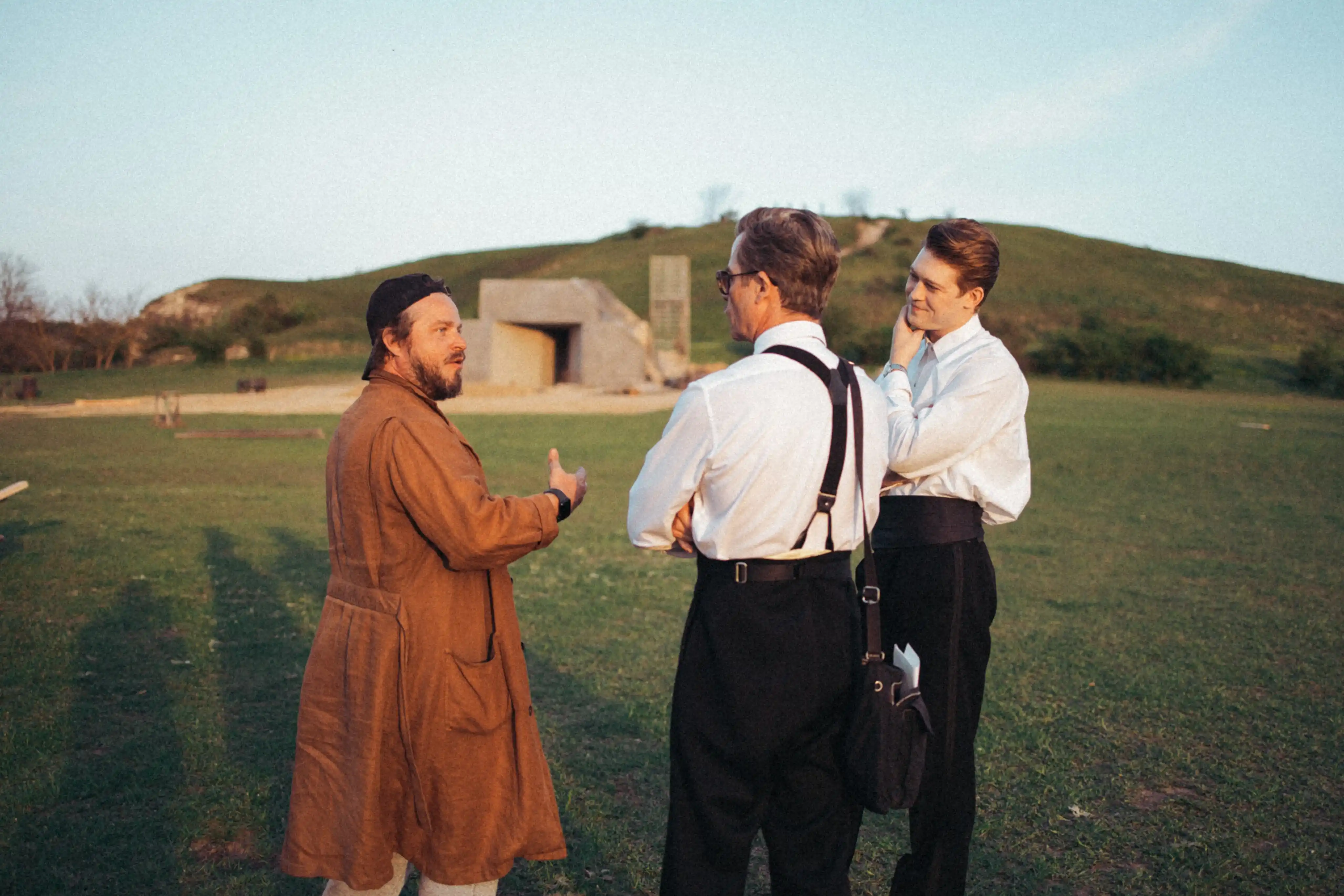 Director Brady Corbet with Guy Pearce (Harrison Lee Van Buren) and Joe Alwyn (Harry Lee Van Buren) on the site of the partially finished Van Buren Institute. Courtesy of Universal Pictures