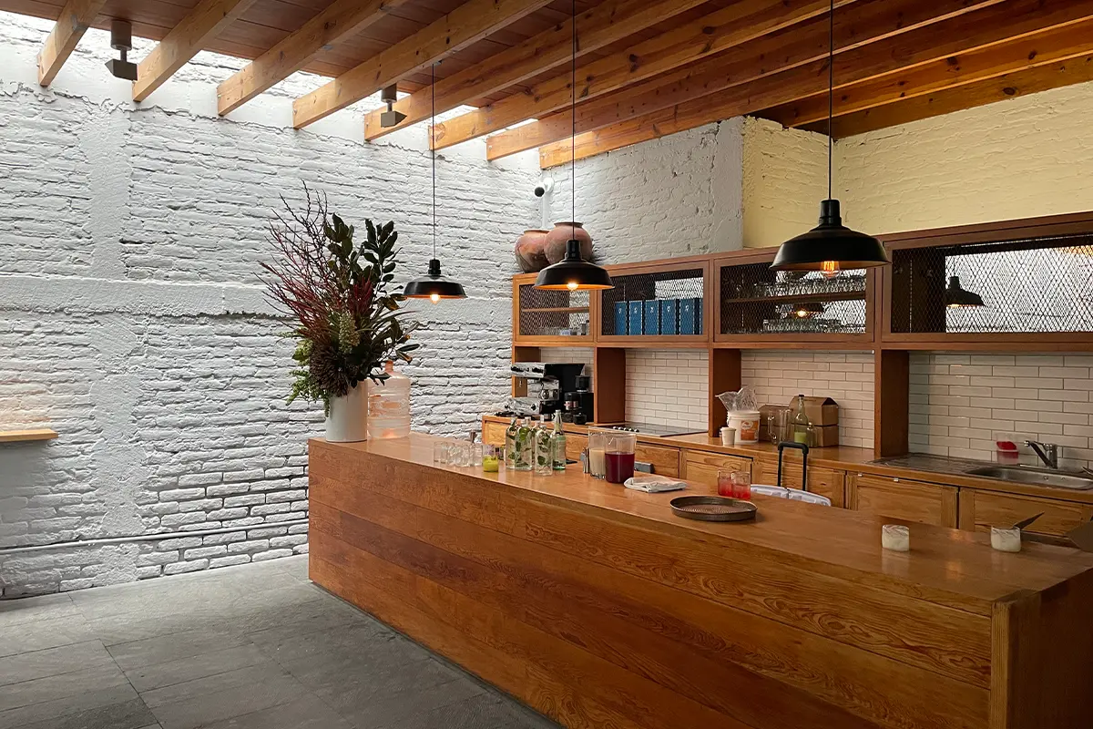The original wood ceiling was preserved by architect Alberto Kalach when designing Kurimanzutto