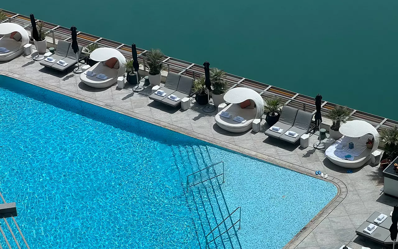 The pool is a geometric design that defies the boundary with the water below