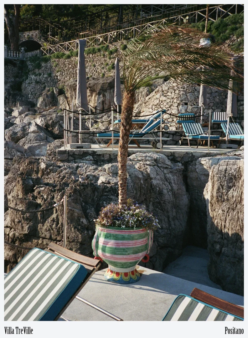 Traditional wooden gozzo tender at the private landing connects guests to the working seascape of Campania