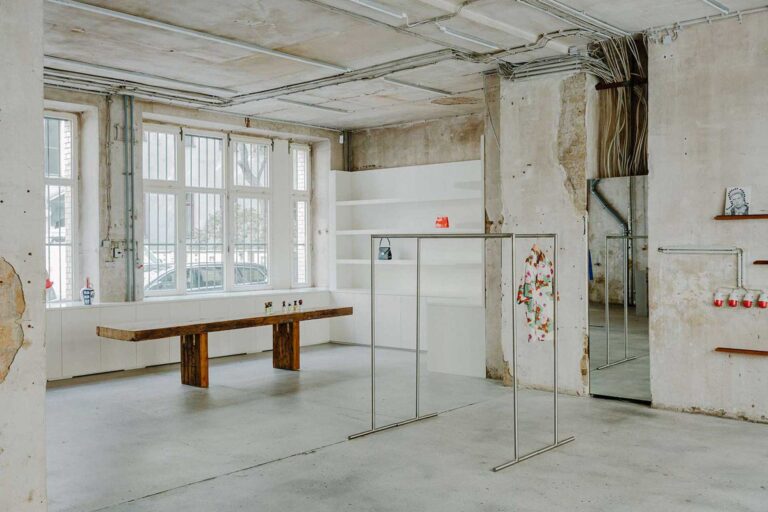 The interior space of VooStore. leaves rough textures and glimpses of bare brickwork visible