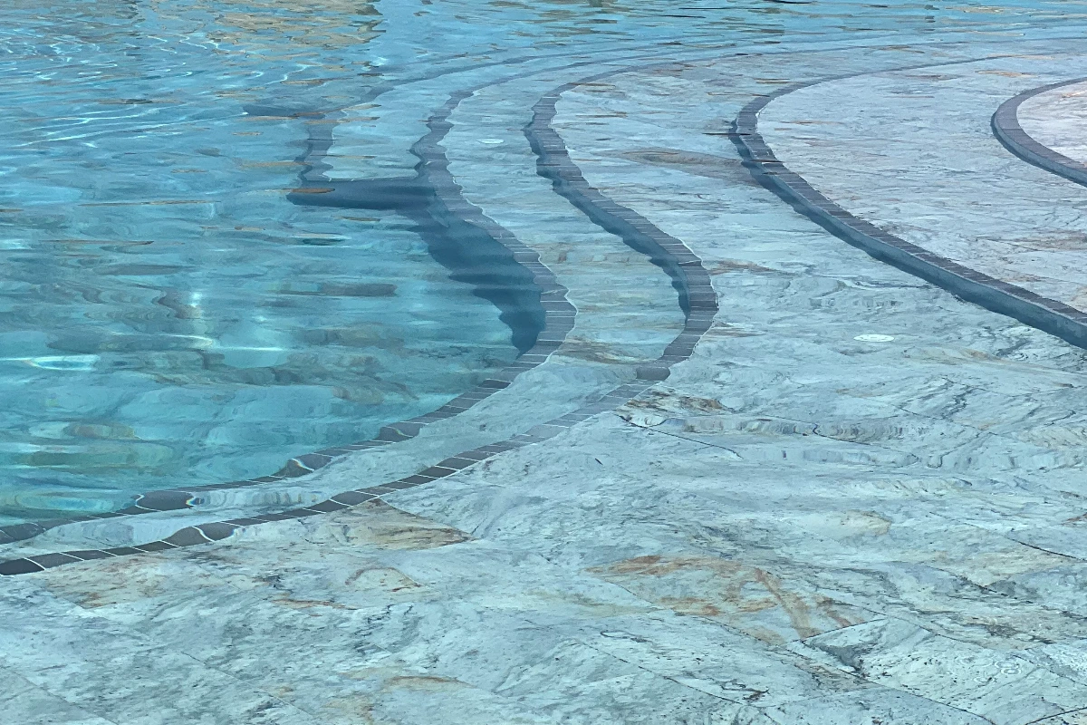 Curved pool steps with contrasting inlays