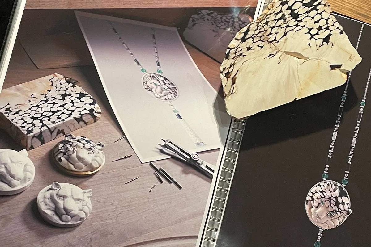 Collections include a few pieces showcasing a carved or sculpted stone, Cartier