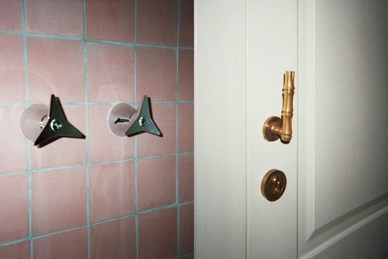 Bathroom Pink Tiles and Shower with white and gold bamboo door levers