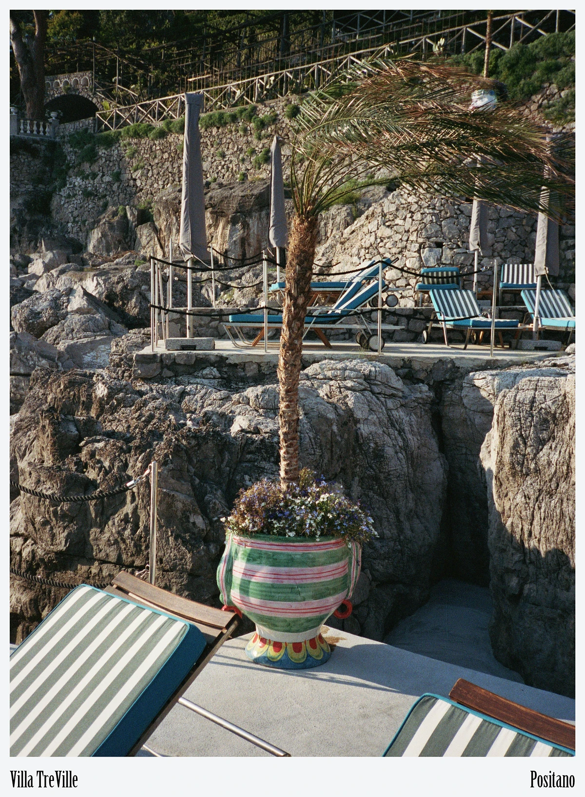 Traditional wooden gozzo tender at the private landing connects guests to the working seascape of Campania