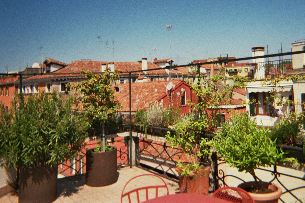 The rooftop terrace of Refugium Amoris overlooking the Ponte delle Guglie