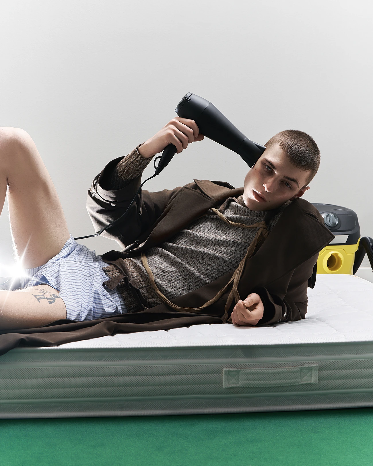 coat Ami Paris, sweater Vivienne Westwood, underwear talent_s own. Photography Lorenzo Venturini, styling Federica Centonze