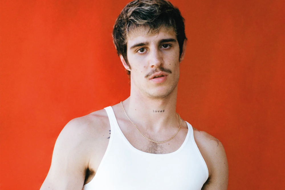 Giovanni wears tank top Ferragamo. Photography Gianmarco Onofri, styling Christian Stemmler