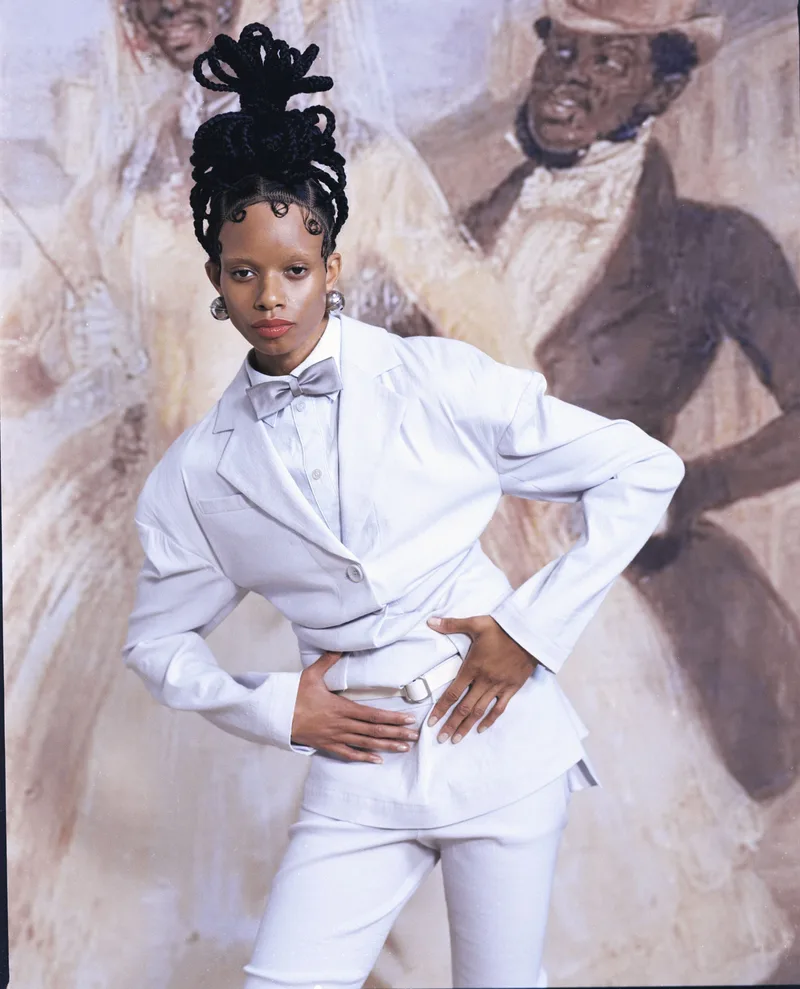 Jacket and top Issey Miyake, earrings Acne Studios, vintage bow tie. Photography Kevin Felicianne, styling Laura McGillivray