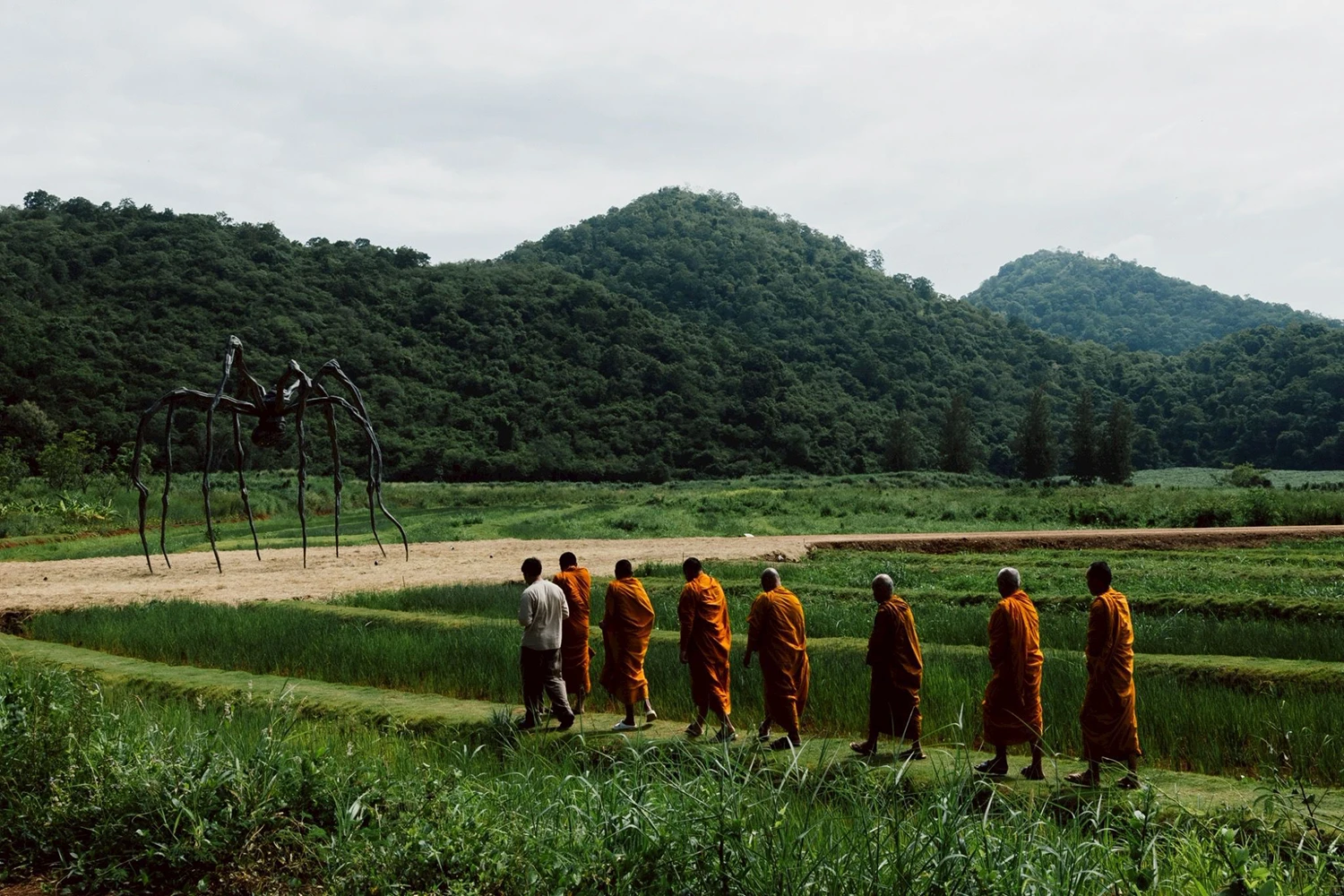 Buddhist monks bless Maman by Louise Bourgeois