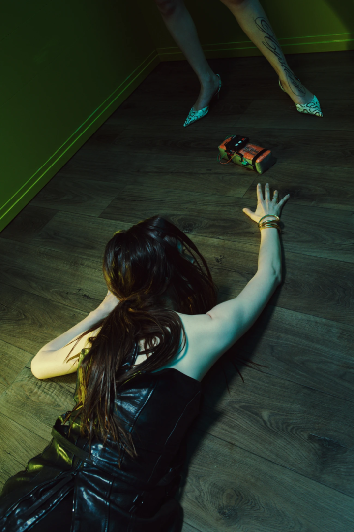 Marie Davidson wears leather corset Eleen Halvorsen, bracelet and rings Charlotte Chesnais_ shoes Amina Muaddi. Photography Geoffrey Leung , styling Hindi Matar