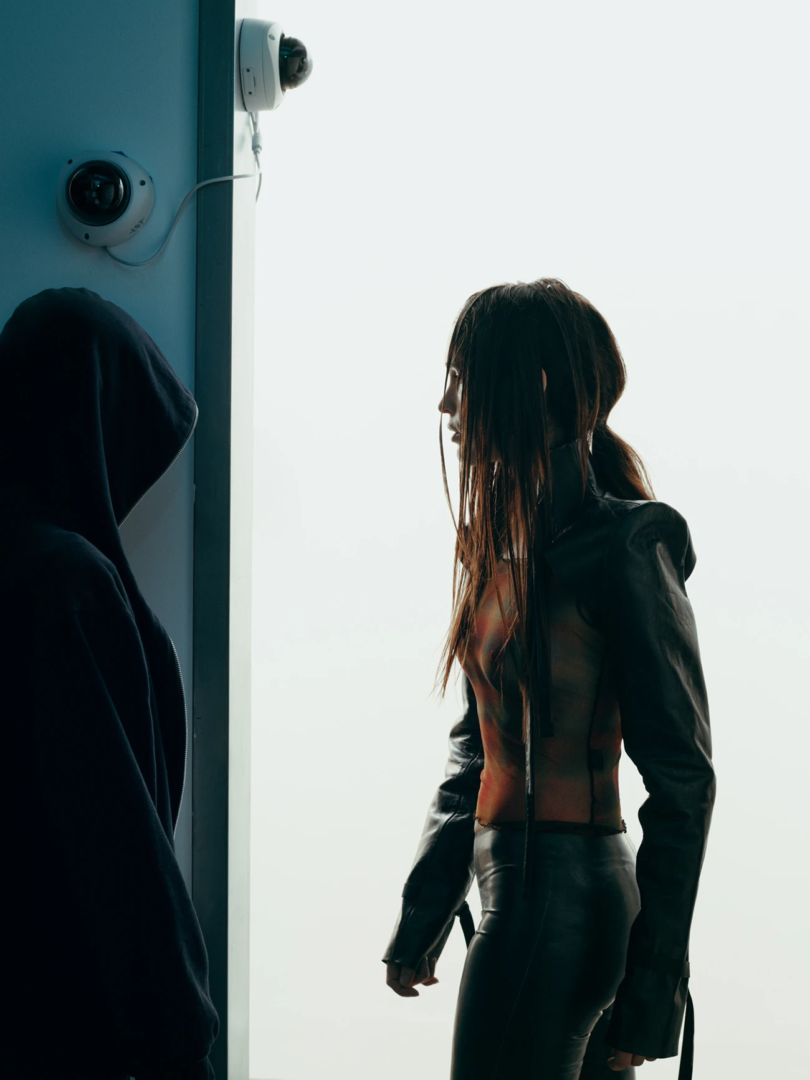 Marie Davidson wears leather sleeves Eleen Holvorsen leather, top Priscavera, pants Anoeses