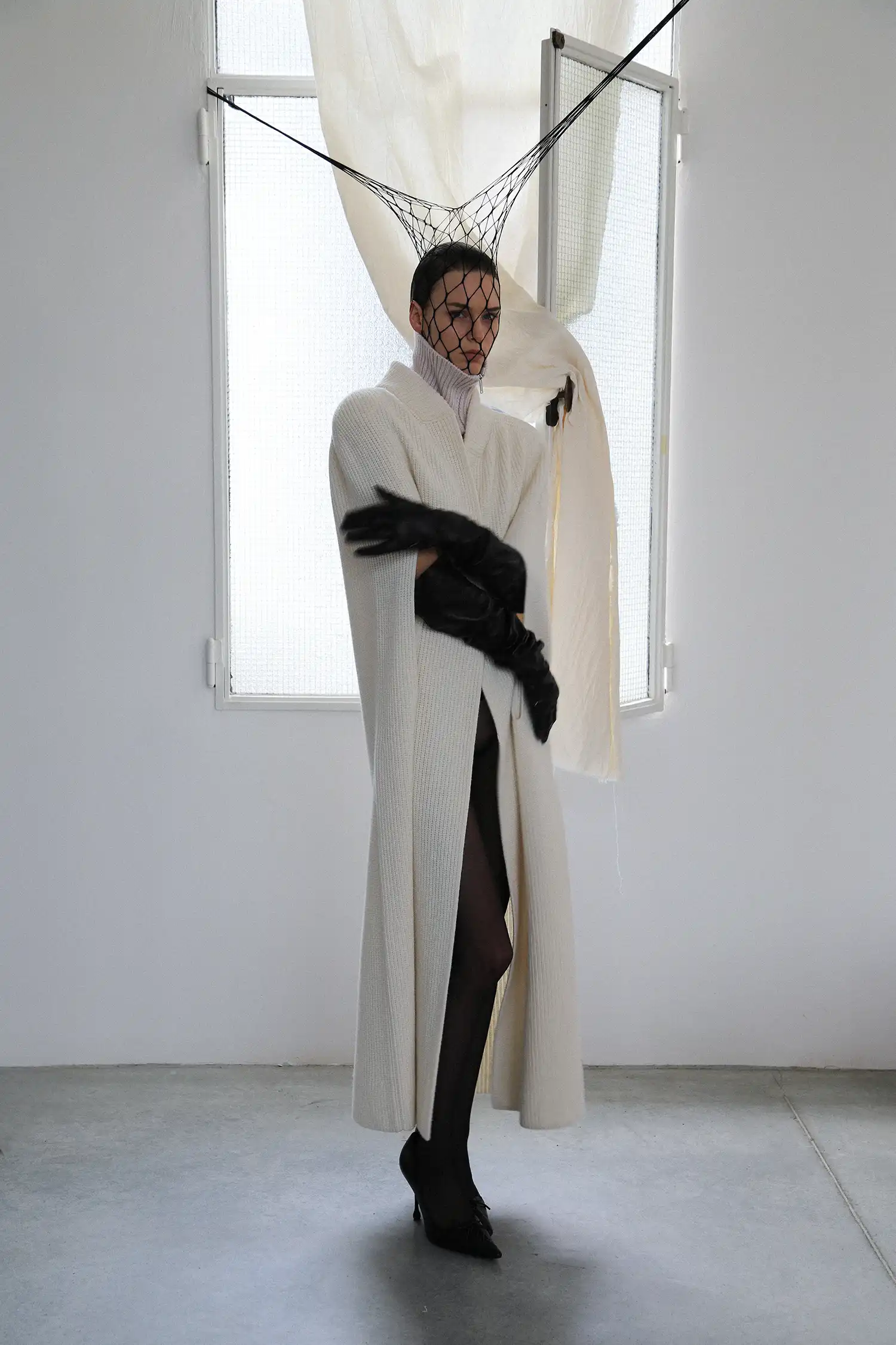 Coat and neckband Sa Su Phi, gloves Maison Margiela, tights Wolford, shoes Jimmy Choo