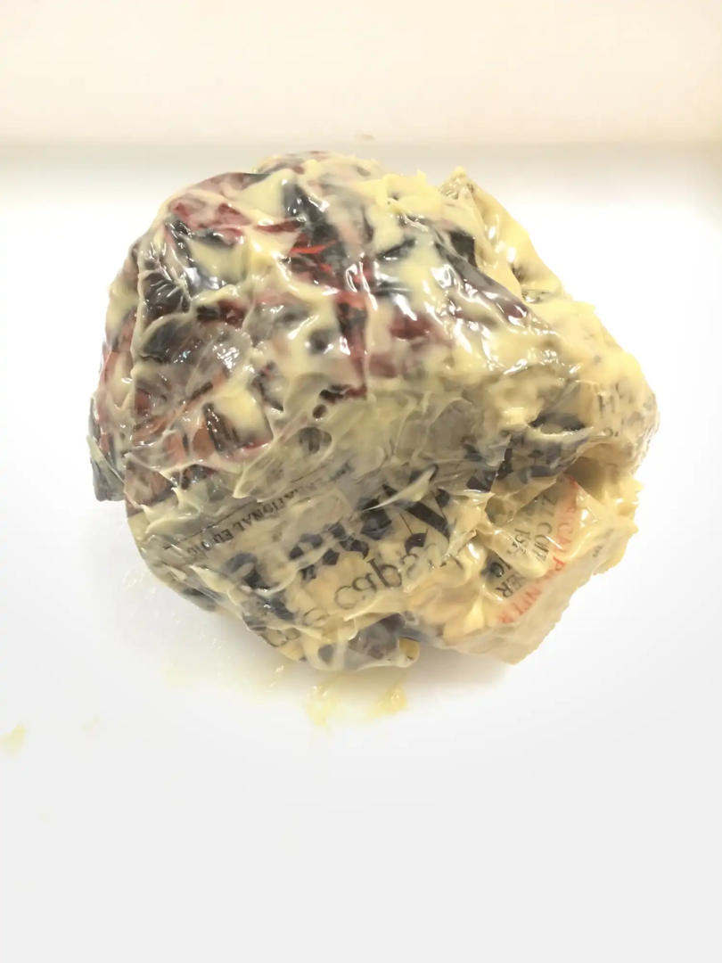 MIRCEA CANTOR, CLEAN HORIZON, 2017, NEWSPAPER (NY TIMES) IMMERSED IN FRESH ALEPPO SOAP, 17 CM Ø. COURTESY OF THE ARTIST