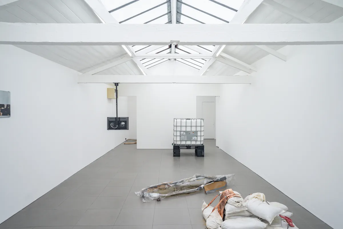 Anastasia Sosunova, Express Method (2022). Water to become holy on the night of the 19th of January, water tank, zinc, temporary tattoos, Sprite Bottles. Courtesy of the artist and eastcontemporary. Photo: Jonas Balsevičius