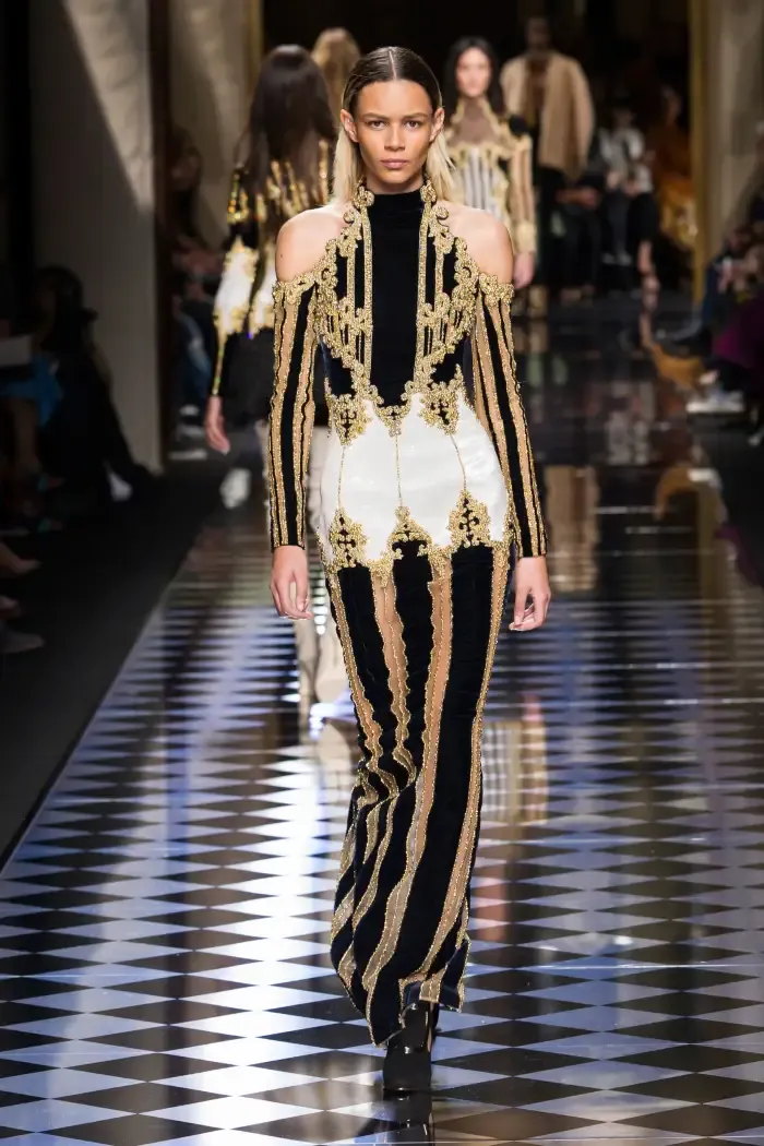 Balmain Fall 2016 look on the runway, foregrounding ornament and metallic detailing