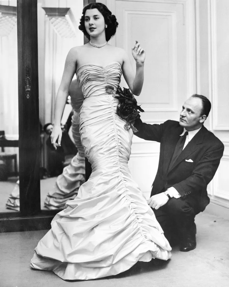 Pierre Balmain, founder of the house. His vision centered on architectural tailoring and couture structure