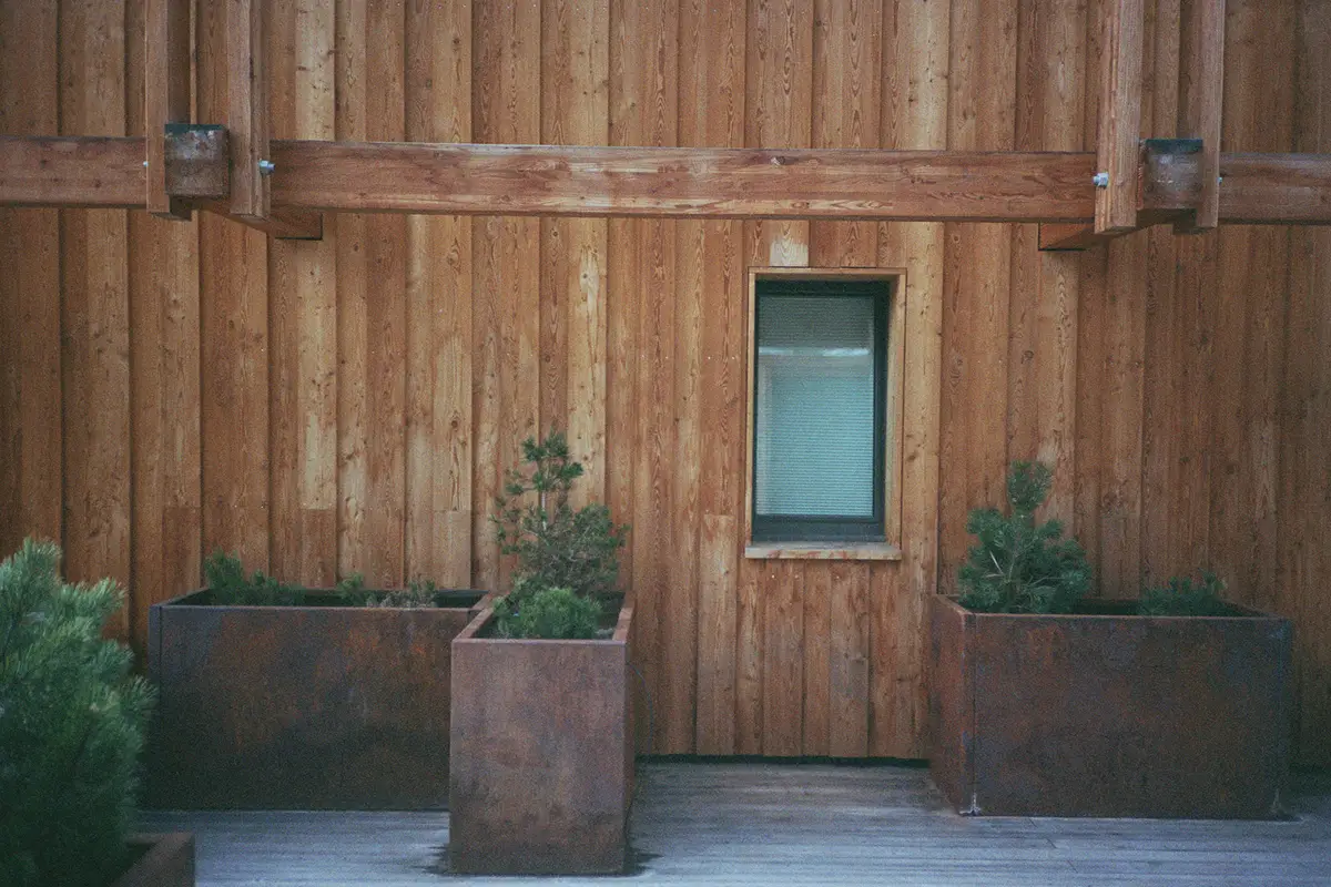 Zermatt. Moody corner with leather lounge chair and globe sconces. Cervo Mountain Resort