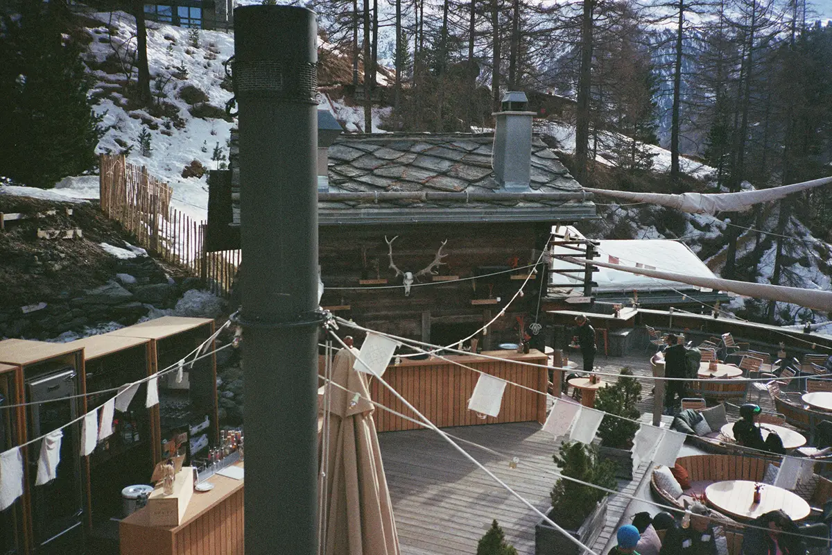 Zermatt. Snow-dusted rooftops stepped into the slope. Cervo Mountain Resort
