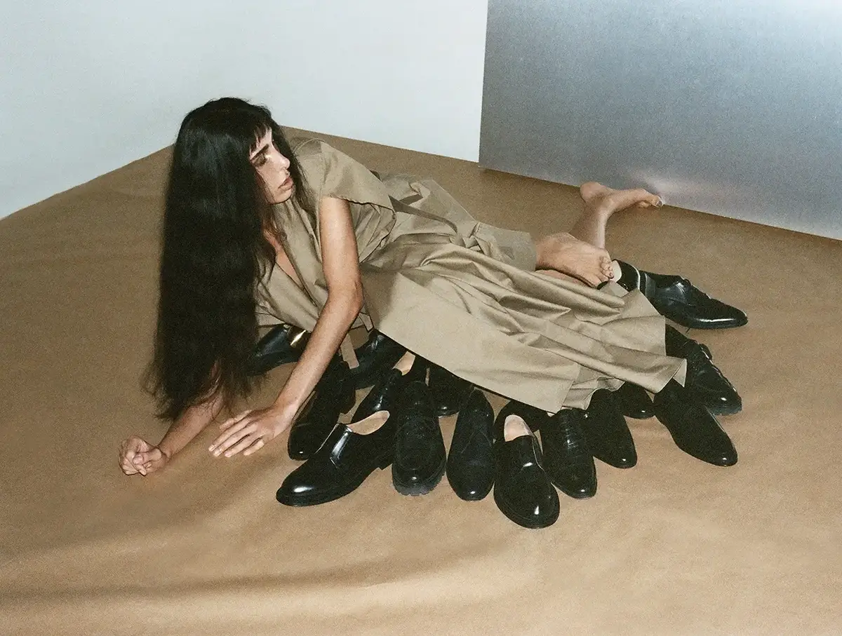 Raya Martigny wears coat Lyrone Journal, shoes John Lobb. Photography Walter Pierre, styling Stefania Chekalina