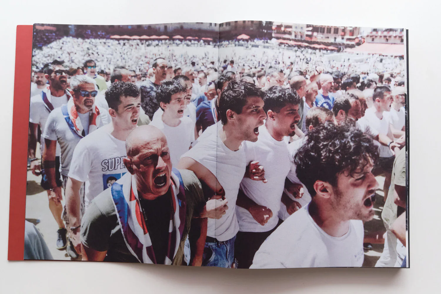 I Ragazzi is a photographic publication by Ed Aked examining representations of masculinity within the social and ceremonial context of the Palio di Siena