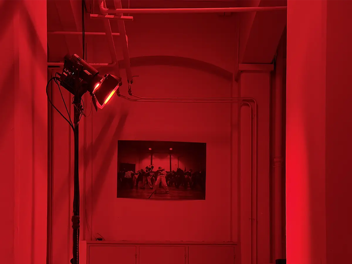 The collection, shown in Paris on June 27, 2026 — the venue bathed in red light, a direct reference to Lynch's Red Room