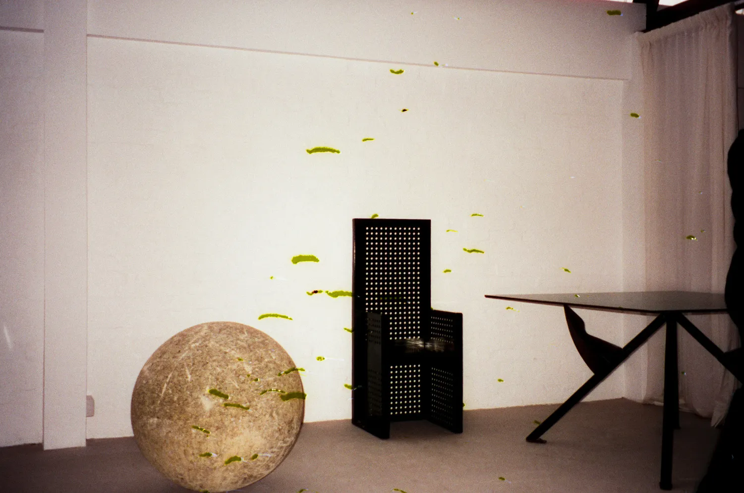 XXL concrete sphere from St Ann’s square, Chair by Urano Palma, President M dining table by Philippe Starck