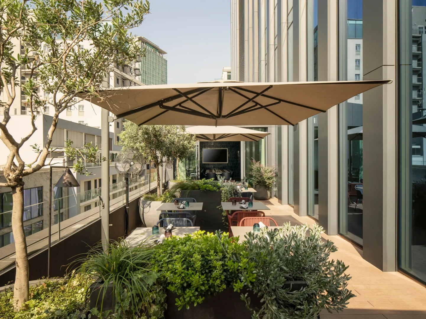 Rivington Milan, the outdoor terrace suspended among Milan's skyscrapers, overlooking Porta Nuova.