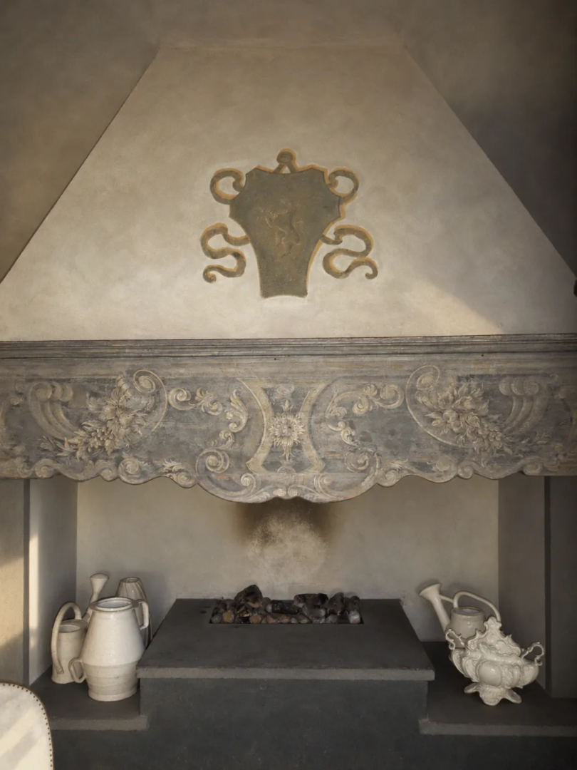 An original fireplace inside COMO Castello del Nero