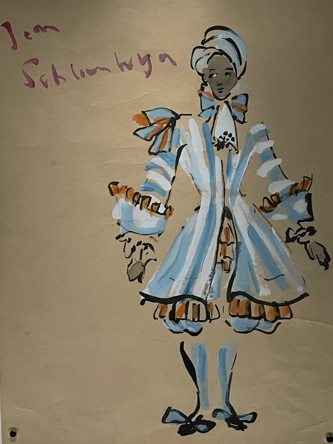 Archival costume illustration from the Tiffany & Co. Jean Schlumberger exhibition, depicting a theatrical figure in a pale blue and white ruffled outfit with orange accents