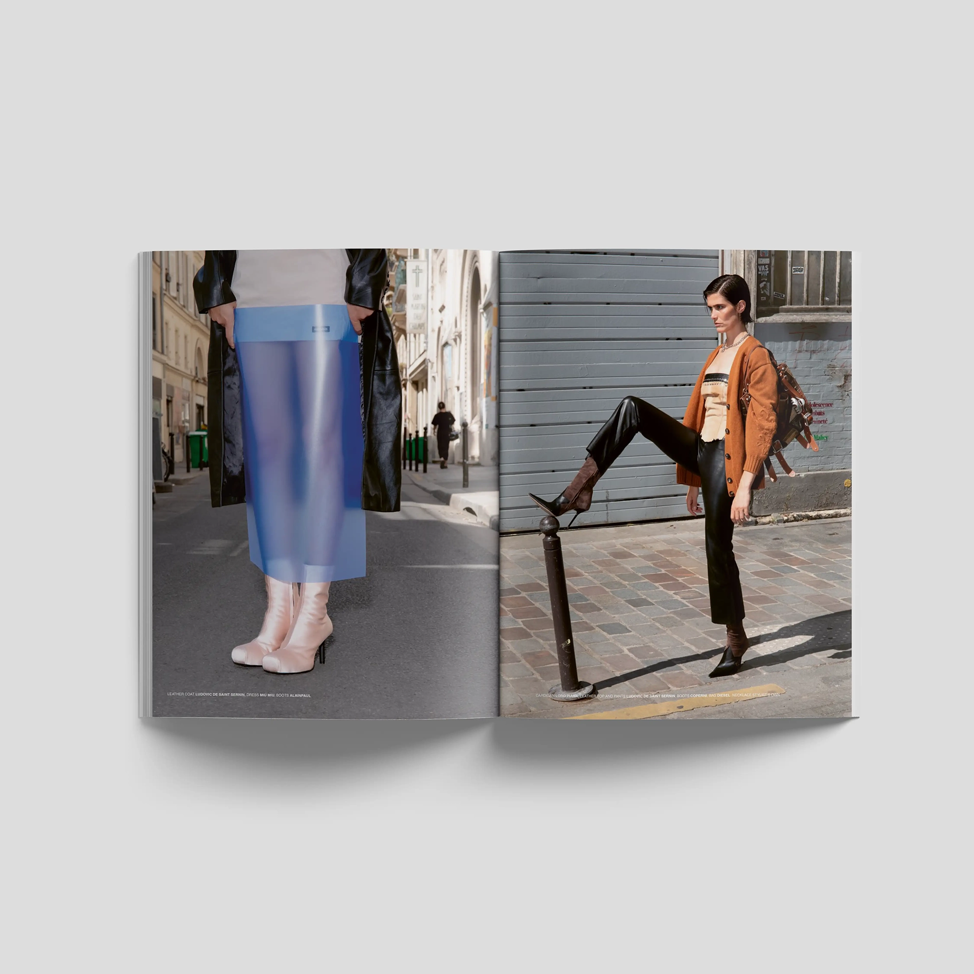 Lampoon SALIVA Issue 34 fashion editorial spread featuring street photography with sculptural clothing, translucent blue styling and a model wearing an orange jacket and black trousers.