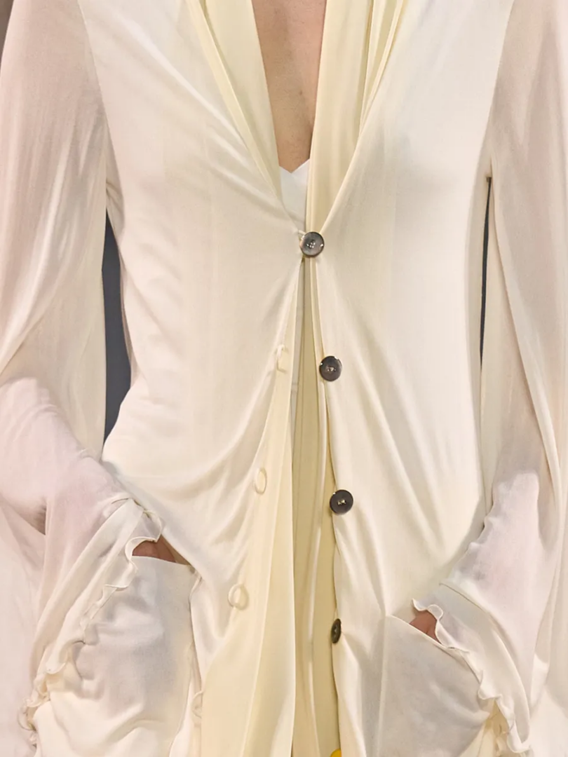 Louis Vuitton SS27 white sheer layered garment with button fastening, draped construction and ruffled cuffs