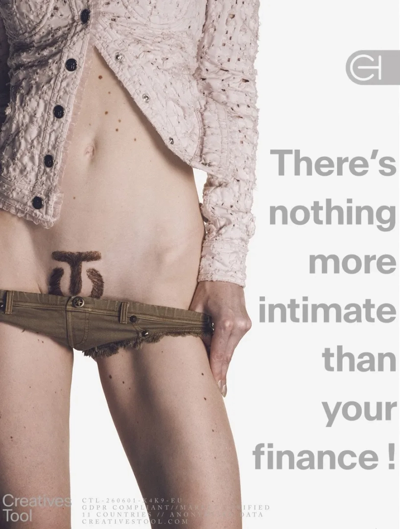 Cropped torso wearing a textured cream jacket and low-rise khaki shorts, revealing a dark symbol in the pubic area. Natacha Voranger for Creatives Tool.
