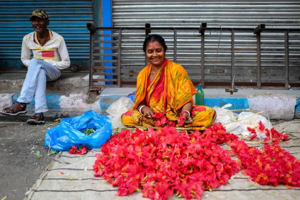 Lampoon, Kolkata (Calcutta), India A woman selling flower garlands from a street stall, G.M.B. Akash, Panos Pictures